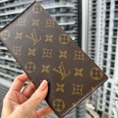 LOUIS VUITTON Vintage LV Monogram Brown Coated Canvas Wallet. Authentic from the 1990(s) Collection. Leather Interior. Made in France.